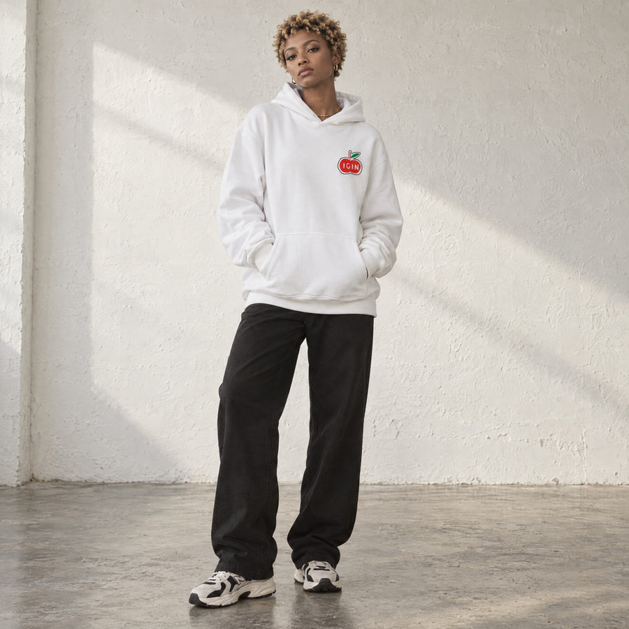 Model wearing the Appuri Heart Relax Hoodie, front view, in a sunlit studio