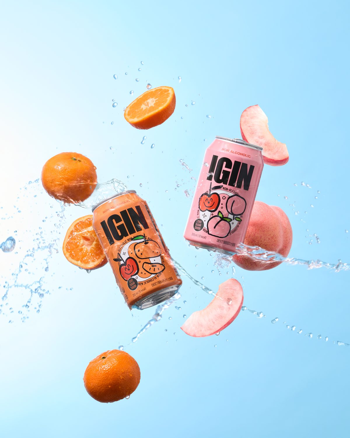 IGIN Apple Citrus and Apple Peach cans flying with fruit and water